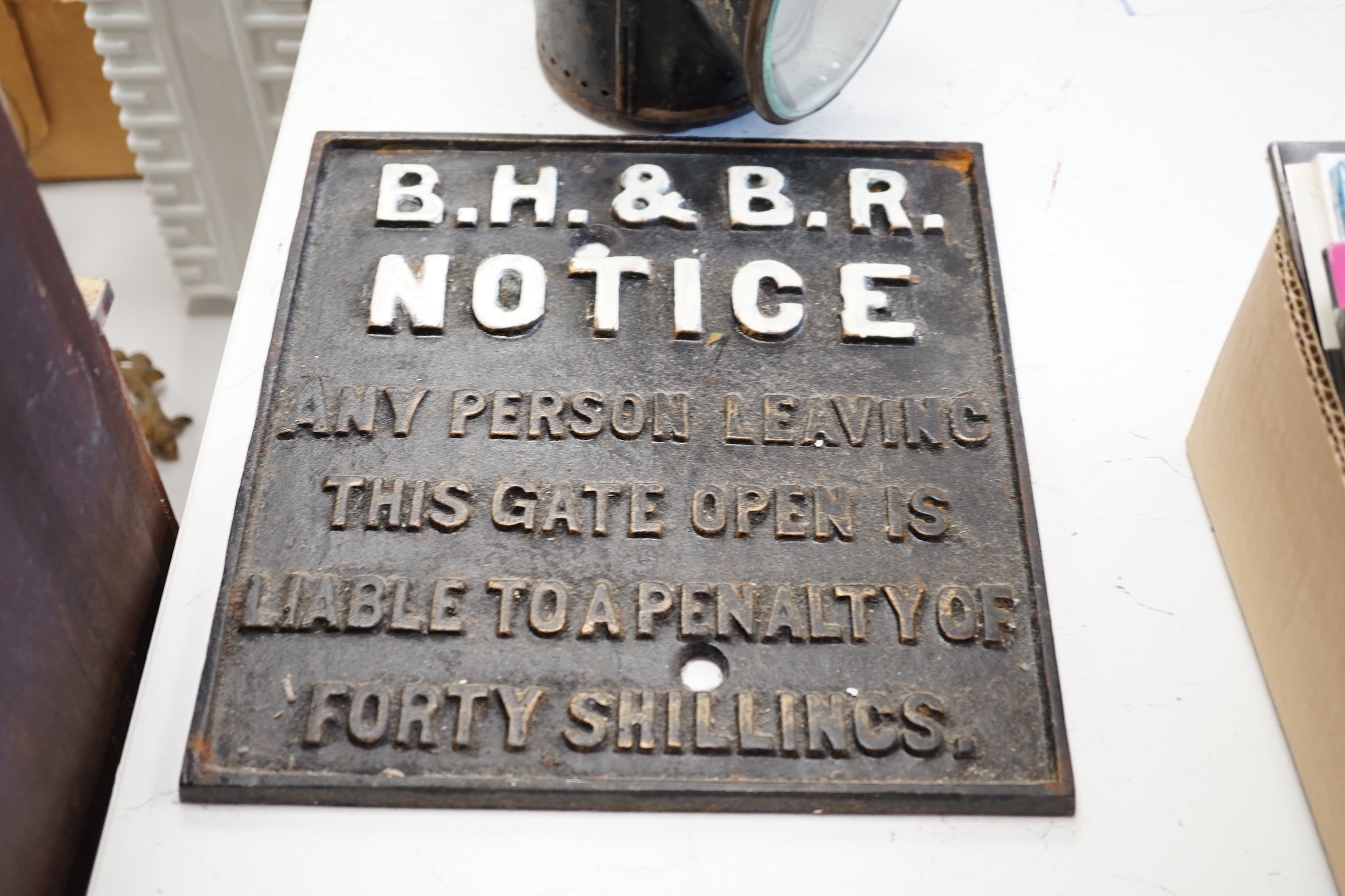 A railway-style clock and a BR hand lamp with burner and 2 signs: BR(W) Goring and Streatley enamel station totem, 91cm long, and an iron warning notice